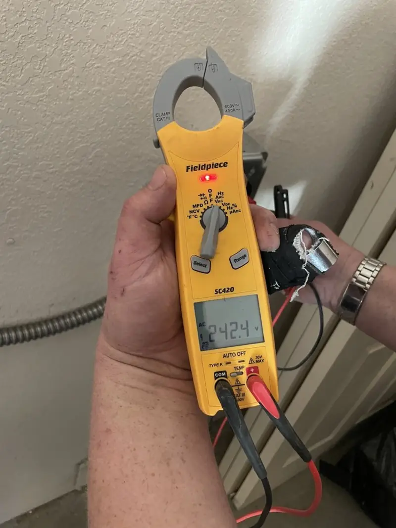 Voltage testing with clamp meter during Recessed Lighting Installation in Walpole